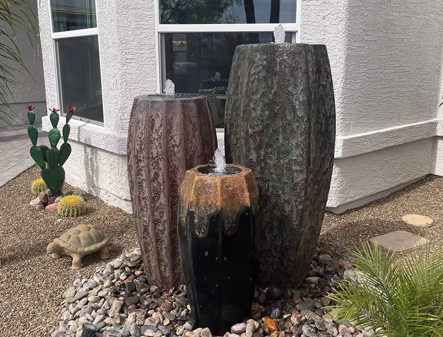 Completed Scottsdale backyard with pavers, turf, and fire feature after Think Green renovation