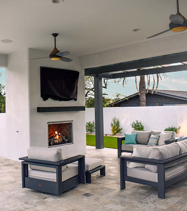 Vertical outdoor fireplace detail by Think Green